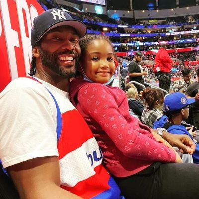 Both are in a stadium watching a match.  